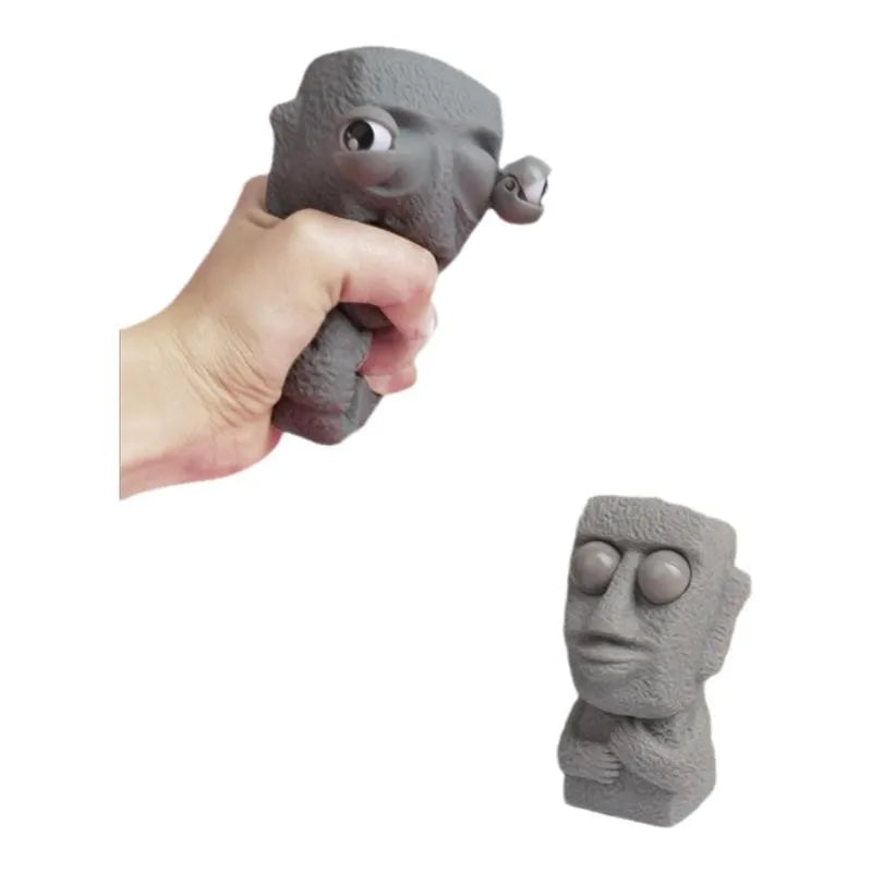 Stone man releases stress toy slowly rebounds soft Moai statue squeeze eyes interested expression relaxes stress children's gift